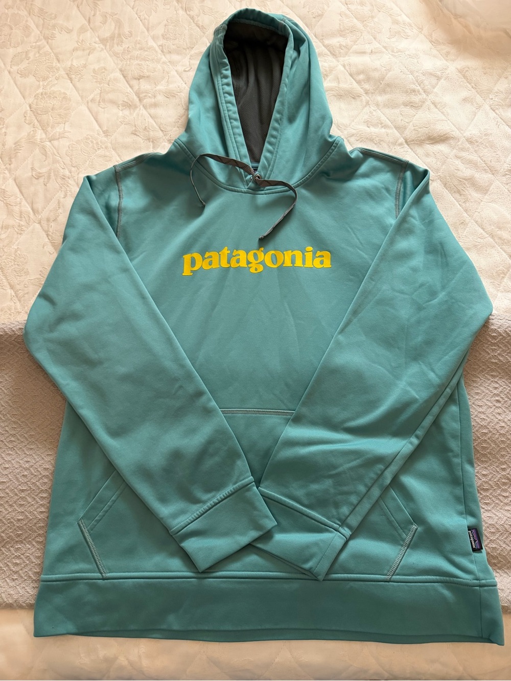 Patagonia women’s like new size lg Teal Hoodie with Yellow Logo